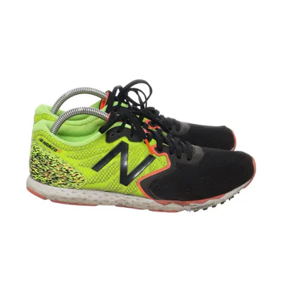 Running shoes (Black, Green) from New Balance