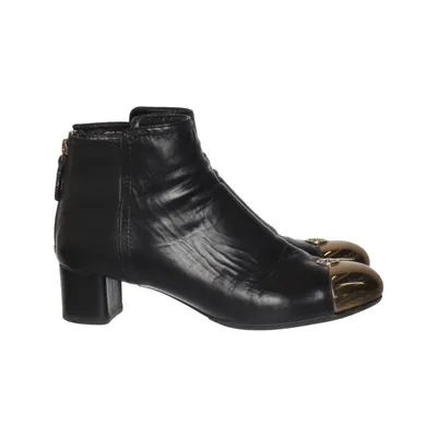 Bottes à talons (Noir, Or) de Tory Burch Cuir