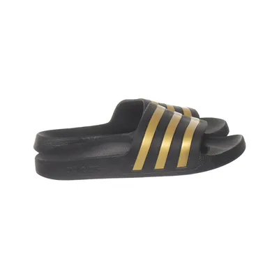 Slip-ins (Black, Gold) from Adidas