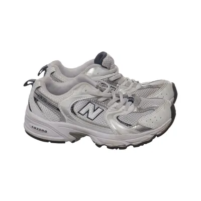 Running shoes (White, Silver, Black) from New Balance
