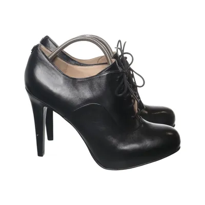Heeled boots (Black) from Guess Polyurethane