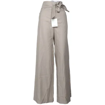 Pantalon patte d'éléphant (Beige) de Totême Laine