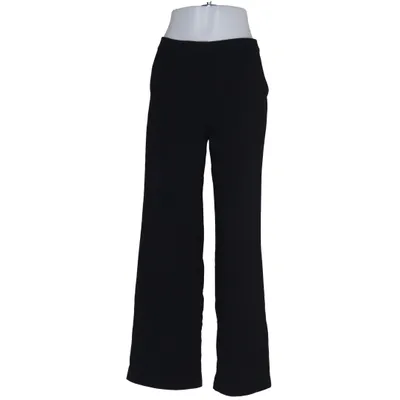 Pantalon patte d'éléphant (Noir) de Nelly Polyester recyclé
