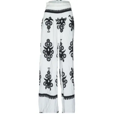 Pantalon patte d'éléphant (Blanc, Noir) de Estee Brown