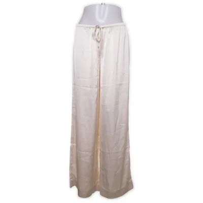 Pantalon patte d'éléphant (Beige) de Nelly Polyester recyclé