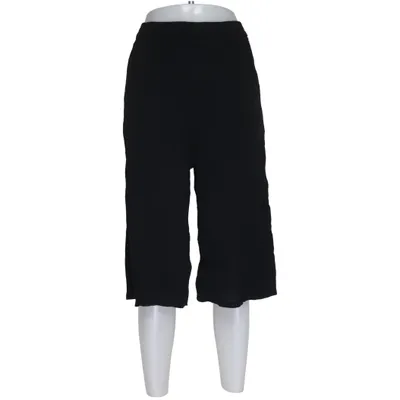 Pantalon patte d'éléphant (Noir) de Oysho Viscose