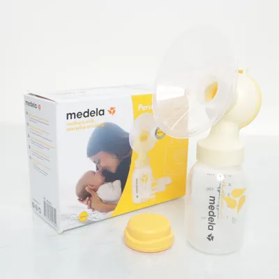 Bröstpump (Vit, Gul) från Medela