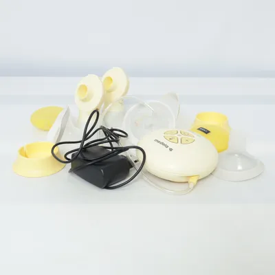 Brystpumpe (Gul, Hvid) fra Medela