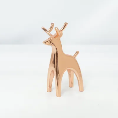 Figurine en porcelaine (Marron) de Umbra
