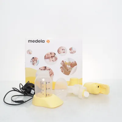 Bröstpump (Vit, Gul) från Medela