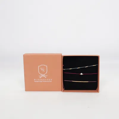 Armband (Pink, Blau, Gold) von Windknoten Unbekanntes Metall