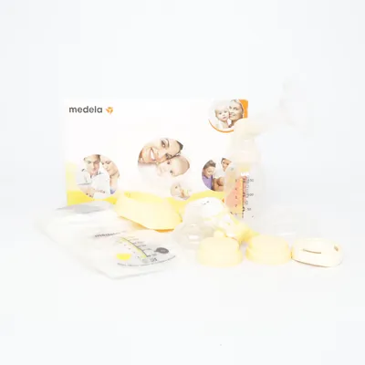 Tire-lait (Jaune, Blanc) de Medela