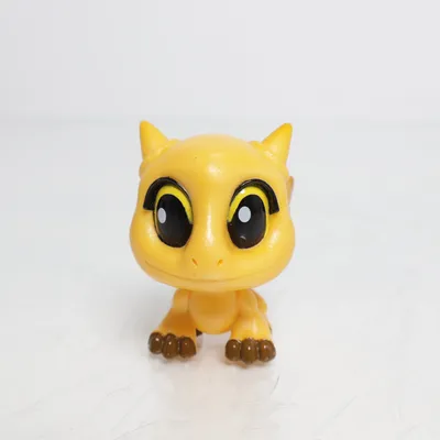 Toy figurine (Yellow, Black, Brown) from DWA LLC