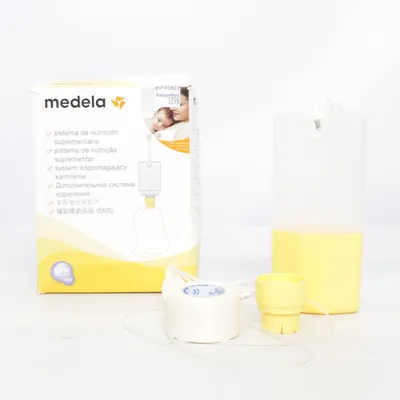 Tire-lait (Jaune, Blanc) de Medela