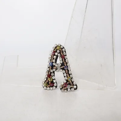 Broche (Noir, Multicolore) Métal inconnu
