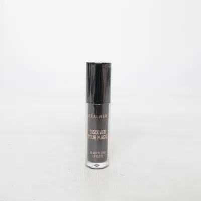 Lip gloss (Ett svart lip gloss som går över till rosa vid användning ) fra Realher