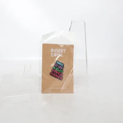 Brooch (‘Smile be kind play video games’ ) from Insert Coin Unknown metal