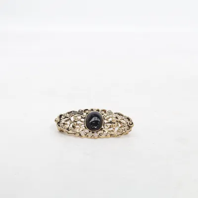 Broche (Or, Noir) Métal inconnu