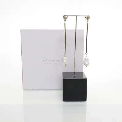 Earrings (Gold, White) from Weat Unknown metal