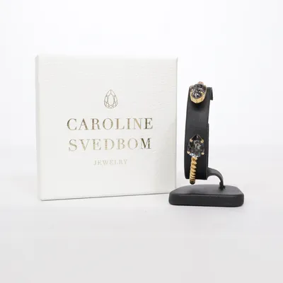 Armband (Guldfärgad, Svart) från Caroline Svedbom Okänd metall
