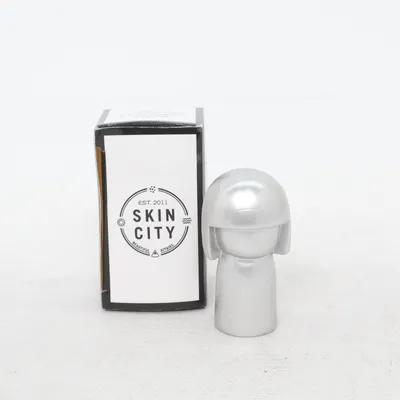 Figur (Kokeshi) fra Skincity