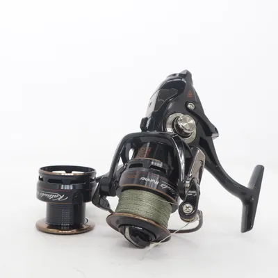 Fishing reel (Baitrunner, Mikado baitrunner reel, baitrunner fishing reel, carp reel, catfish reel, pike reel, predator fishing reel, spinning reel, feeder reel, big pit reel, rear drag reel, baitrunner system, carp fishing, pike fishing, catfish fishing, predator fishing, freshwater fishing, angling gear, fishing tackle, premium reel, braided line included, spare spool included, fishing equipment, feeder fishing, deadbait fishing, specimen fishing, big fish reel, quality fishing reel, outdoor sport, fisherman gear, carp tackle, pike tackle, used once, excellent condition, ready to fish, rare fishing gear, smooth drag, powerful reel, long cast reel ) from Mikado