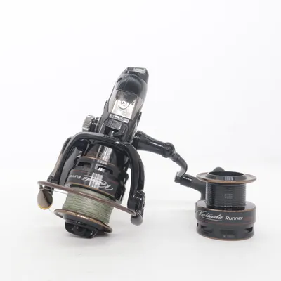 Fishing reel (Mikado, fishing reel, spinning reel, carp reel, carp fishing, feeder reel, match fishing, coarse fishing, predator fishing, pike fishing, zander fishing, perch fishing, salmon fishing, trout fishing, sea fishing, freshwater fishing, angling, sport fishing, big fish, fishing gear, fishing equipment, tackle, premium reel, high end reel, long cast reel, spare spool, graphite spool, aluminum spool, front drag, smooth drag, precision reel, durable, lightweight, balanced, performance, outdoor, camping, survival, hunting, boating, kayak fishing, bank fishing, lake fishing, river fishing, professional angler, fishing enthusiast, tackle box, rod and reel, fishing setup, cast, retrieve, fish on, catch of the day, adventure, nature, premium quality, bestseller, gift for fisherman, trending, TikTok made me buy it, viral, outdoor lifestyle, carp tackle, specimen fishing, coarse angling, feeder tackle, spinning tackle, fishing accessories, sports equipment.) from Mikado