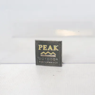 Pin (Black, Yellow) from Peak Performance Unknown metal