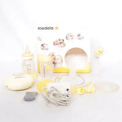 Bröstpump (Vit, Gul) från Medela