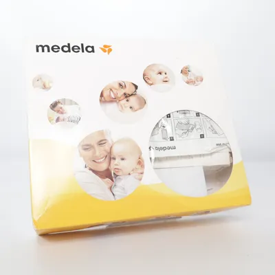 Tire-lait (Blanc, Jaune) de Medela