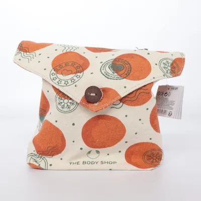 Trousse de toilette (Beige, Orange, Vert) de The Body Shop