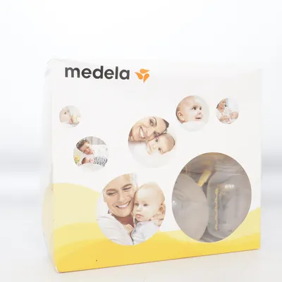 Tire-lait (Jaune, Blanc) de Medela