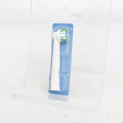 Toothbrush head (White, Green) from Oral-B