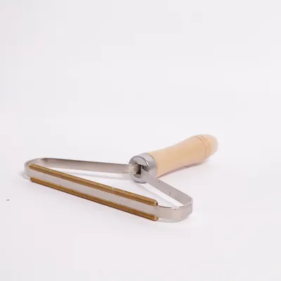 Fnugfjerner (Beige, Sølv) fra Falconeri