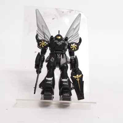 Toy figurine (Black, Silver, Gold) from Bandai
