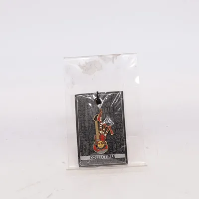 Pin (Core Bagpipe Guitar GLG) from Hard Rock Cafe Unknown metal