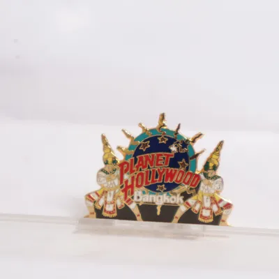 Brosch (Guldfärgad, Flerfärgad) från Planet Hollywood Okänd metall
