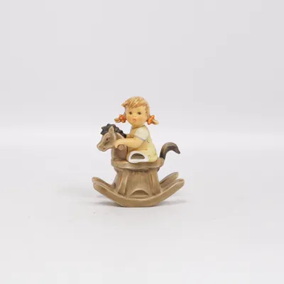 Toy figurine (Little Girl On Rocking Horse) from Goebel