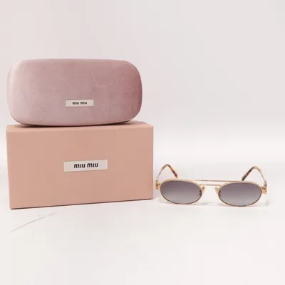 Lunettes de soleil (Or) de Miu Miu