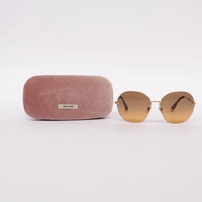 Lunettes de soleil (Marron, Or) de Miu Miu