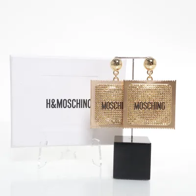 Clips-örhängen (Ikonisk kollektion Jeremy Scott Fantastisk design) från H&M x Moschino Okänd metall