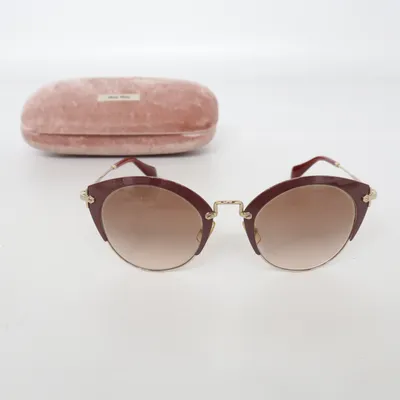 Sunglasses (SMU 53R) from Miu Miu