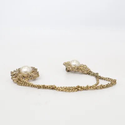 Brosch (Guldfärgad) från TKI Mage Okänd metall