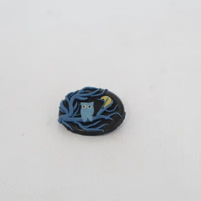 Broche (Noir, Bleu, Jaune) Métal inconnu