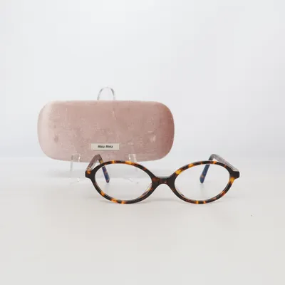 Glasses (VMU 01X) from Miu Miu
