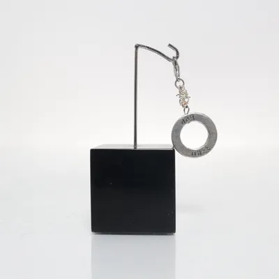 Berlock (Silverfärgad) från Dag Natt Okänd metall