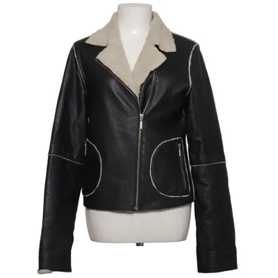 Veste en peau de mouton retournée (Noir, Beige) de Joy Acrylique, Cuir, Polyester