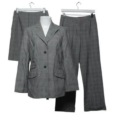 Dräkt (Like new, 100% wool, houndstooth pattern, classic cut.) från Hexeline Elastan, Ull