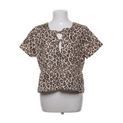 Top péplum (Beige, Marron, Blanc) de Gina Tricot Coton biologique