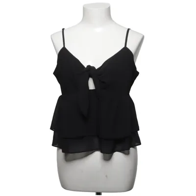 Linne (Svart) från Pamela x NA-KD Polyester